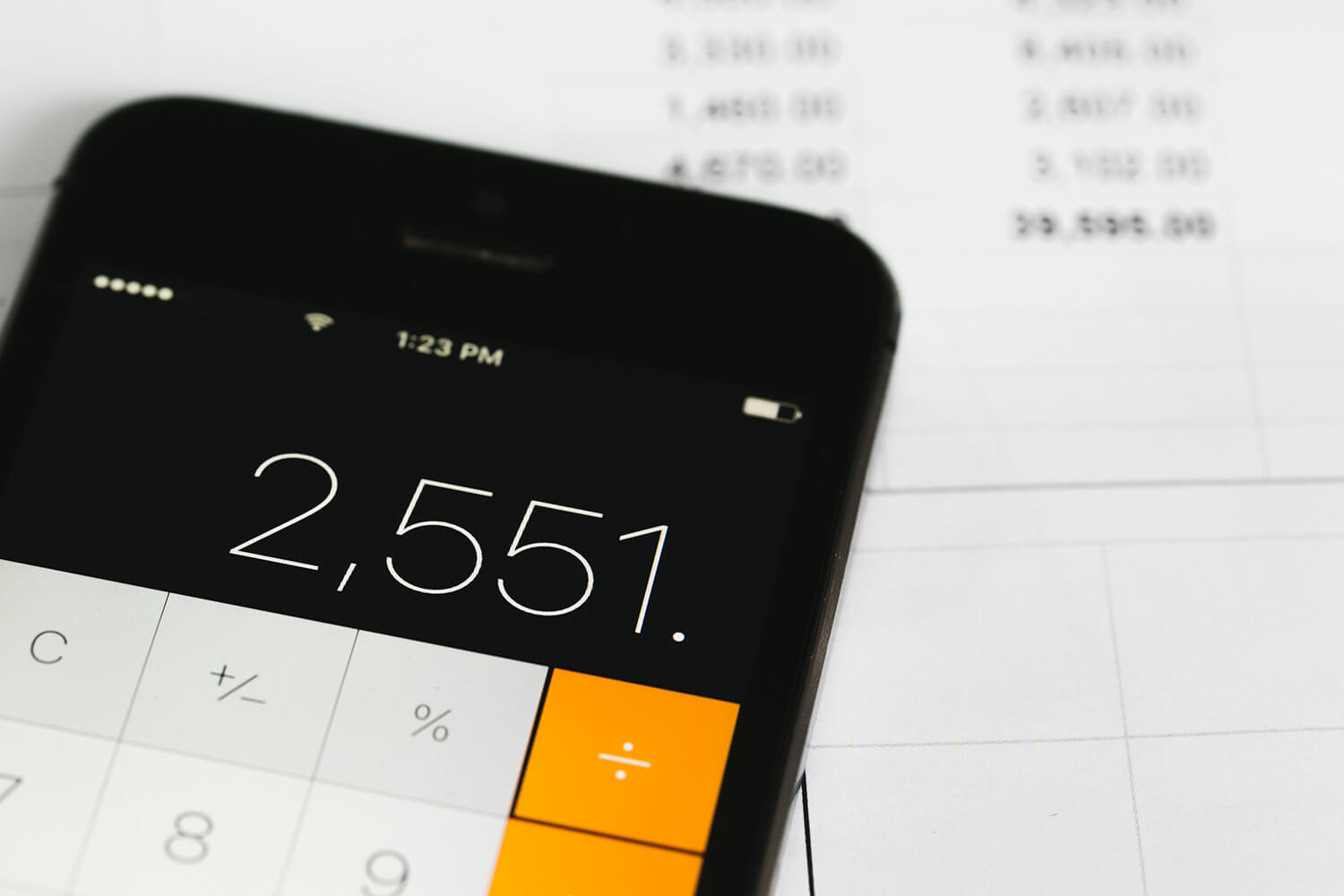 A calculator and financial sheet represent the rewards of our “Earn While You Create” programme, empowering community creators to monetise their jewellery designs.