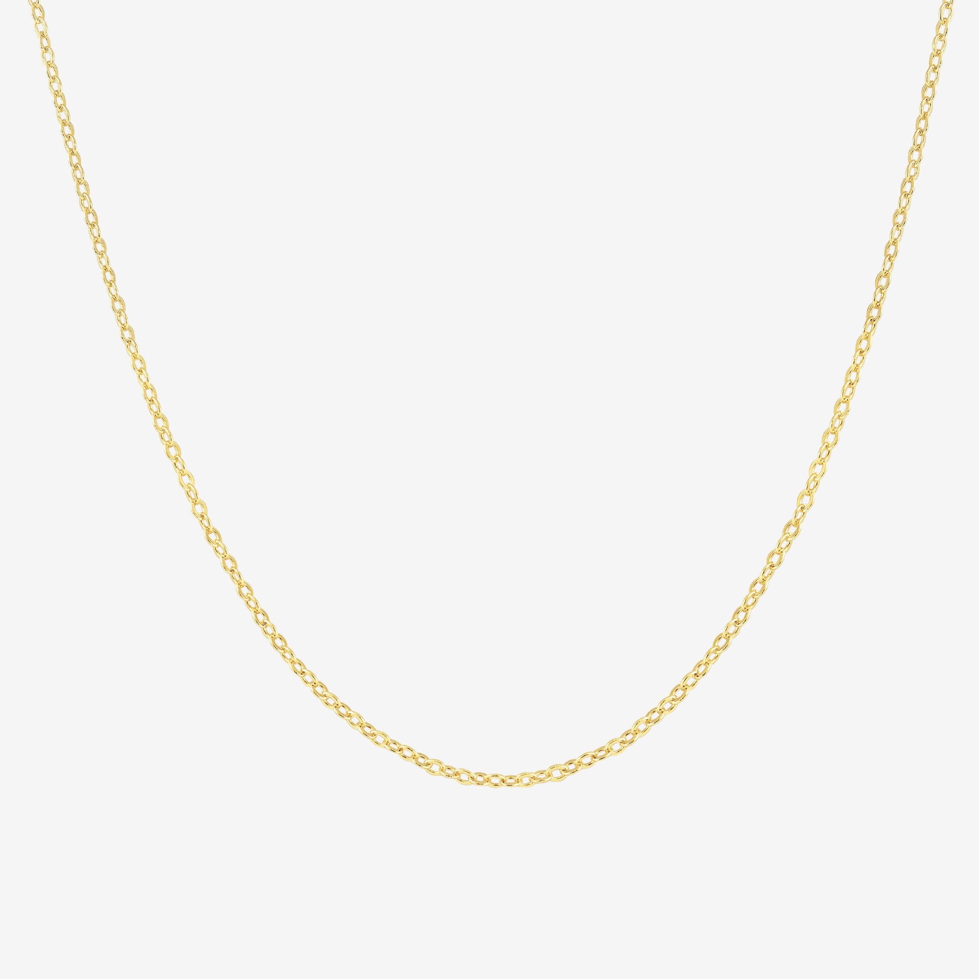 Studio shot of a 18k yellow gold chain necklace with fine cable links, displayed against a light grey background