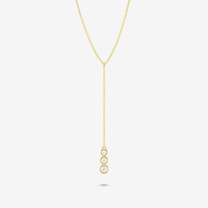 Studio shot of the Gold Astral Necklace featuring a lariat Y-necklace design with three vertically aligned bezel-set moissanites in a drop pendant on a light grey background
