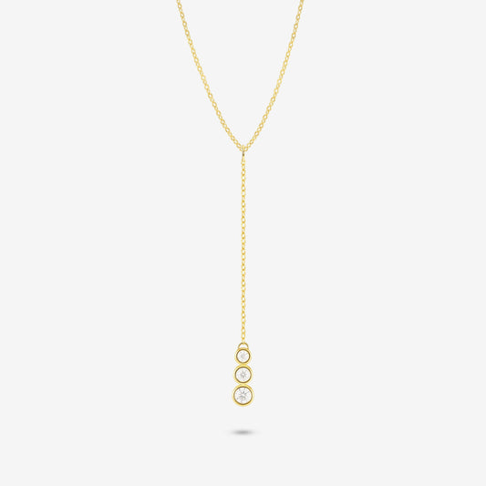 Studio shot of the Gold Astral Necklace featuring a lariat Y-necklace design with three vertically aligned bezel-set moissanites in a drop pendant on a light grey background
