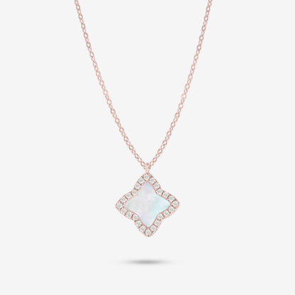 Studio shot of the Rose Gold Edea Necklace displaying a four-petal flower pendant highlighted by a mother-of-pearl center and moissanite border against light grey background
