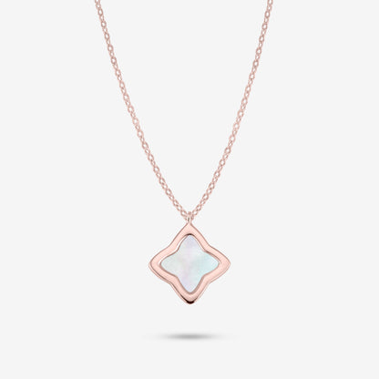Studio shot of the Rose Gold Creia Necklace with a clover-shaped pendant and mother-of-pearl center on a grey background