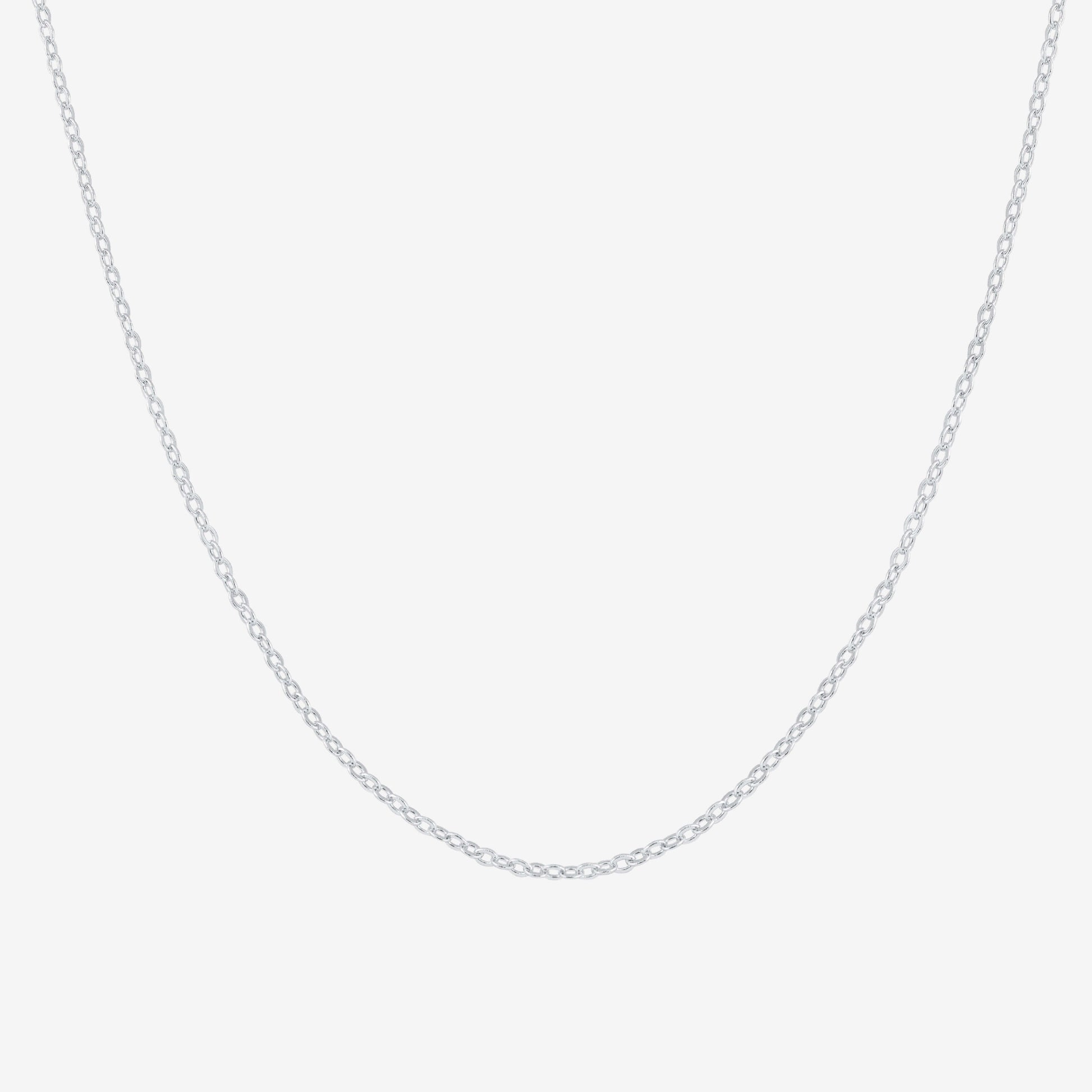 Studio shot of a sleek 925 silver chain necklace with delicate cable links, presented on a pale grey background