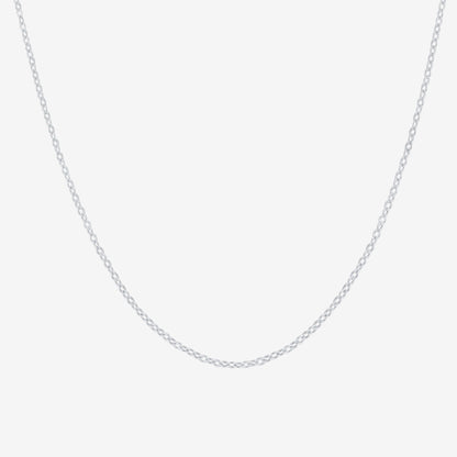 Studio shot of a sleek 925 silver chain necklace with delicate cable links, presented on a pale grey background