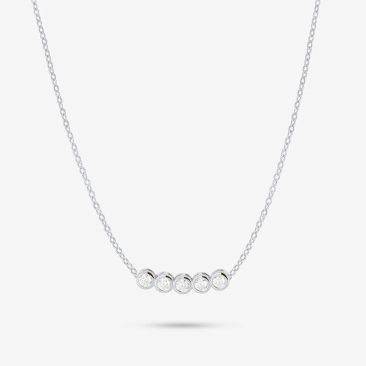 Studio shot of the Silver Dawn Necklace showcasing five bezel-set moissanites in a straight row on a slender silver chain, presented on a pale grey background