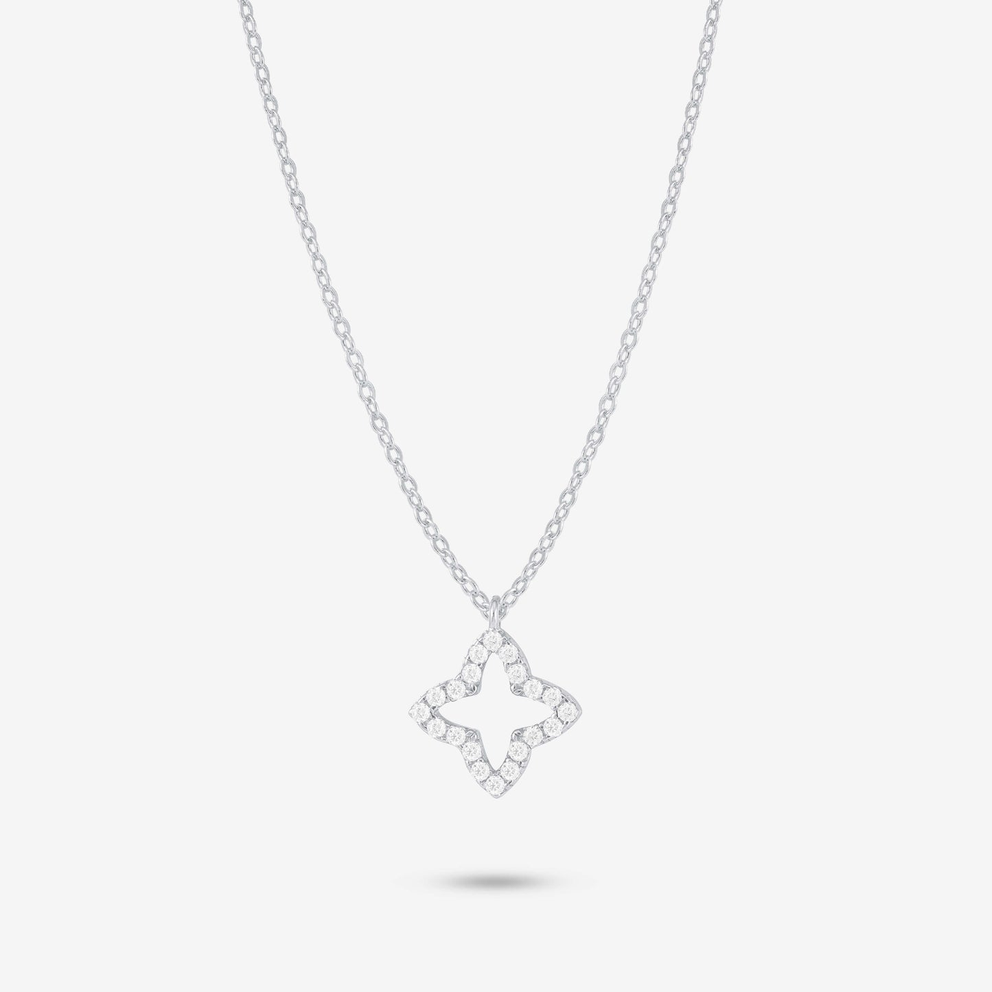 Studio shot of the Silver Eden Necklace with a moissanite-trimmed floral pendant on a delicate silver chain against a soft grey background