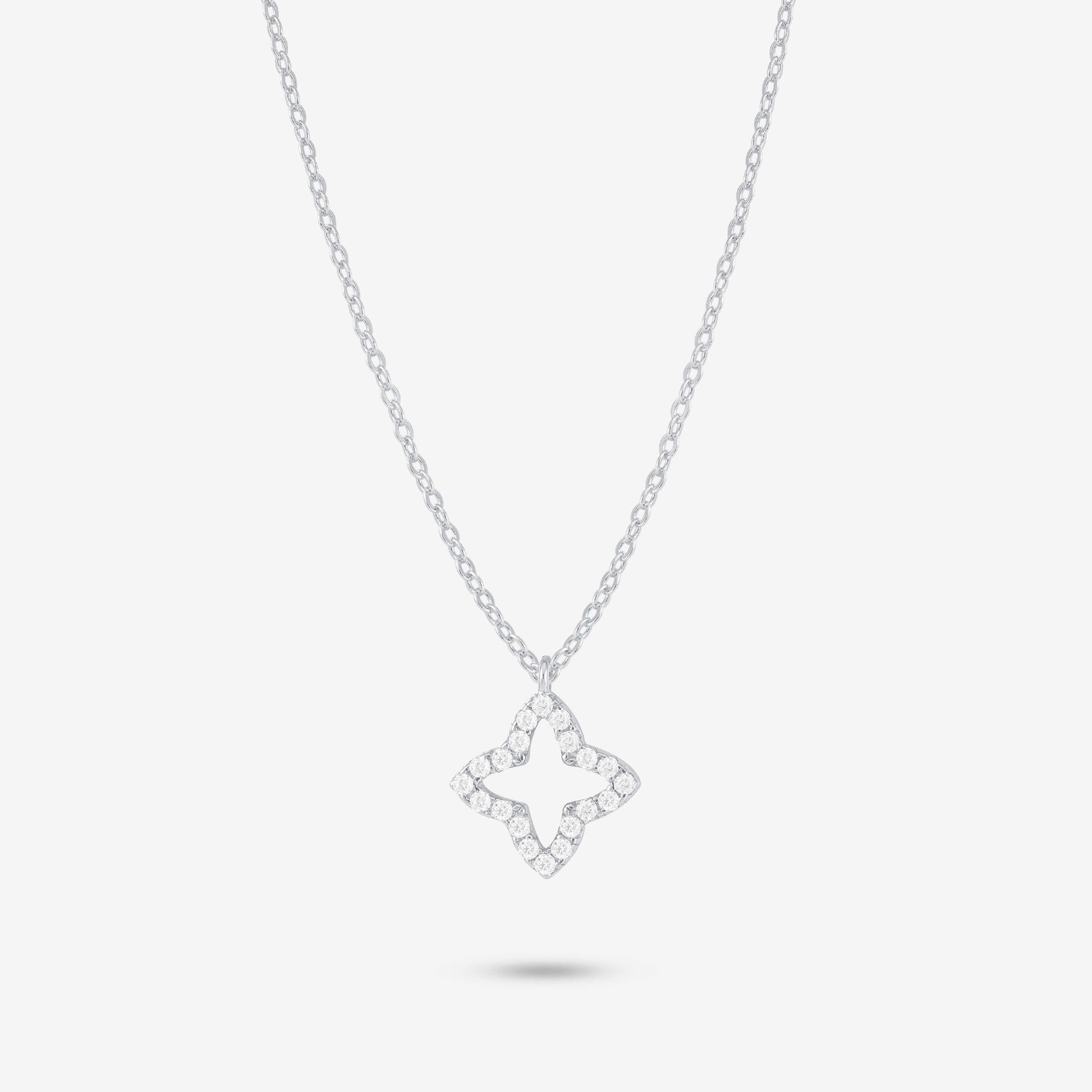 Studio shot of the Silver Eden Necklace with a moissanite-trimmed floral pendant on a delicate silver chain against a soft grey background
