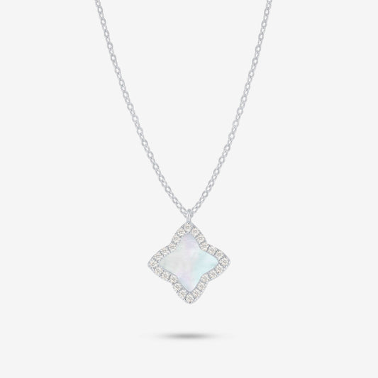 Studio shot of the Silver Edea Necklace featuring a quatrefoil pendant with mother-of-pearl inlay surrounded by moissanites on a light grey background