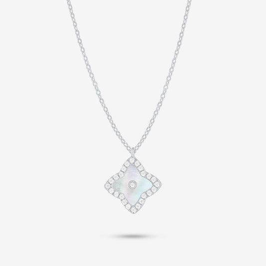 Studio shot of the Silver Irida Necklace with a quatrefoil mother-of-pearl pendant, moissanite halo, and bezel-set center stone on a grey background.