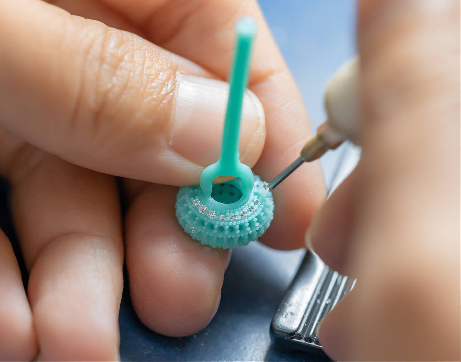 The collaborative process behind our Community Creator Programme, where our skilled artisans hand-set sparkling stones into a unique jewellery design imagined by you.