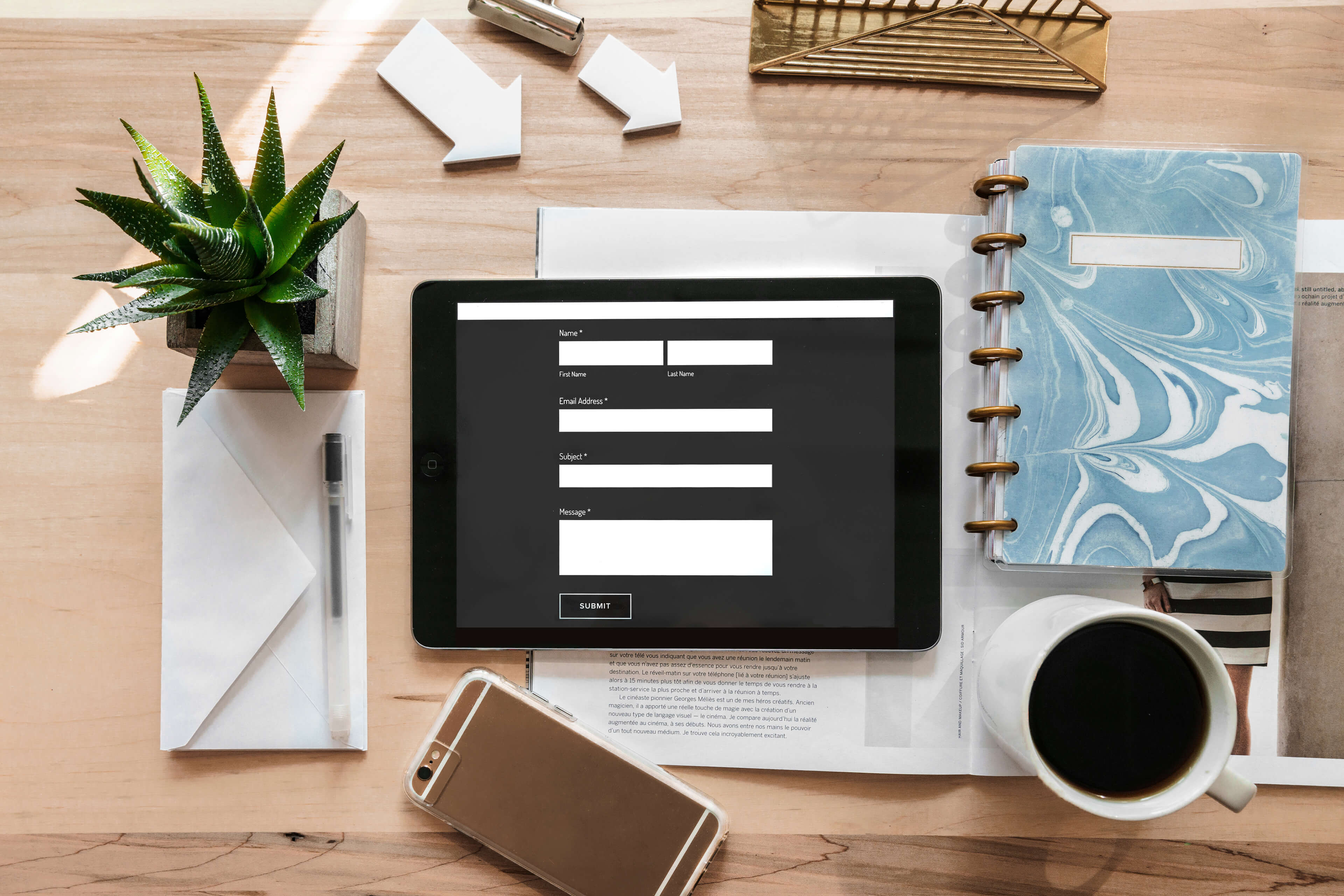 A stylish workspace showing the online form to apply to become a Pure Moments brand ambassador.
